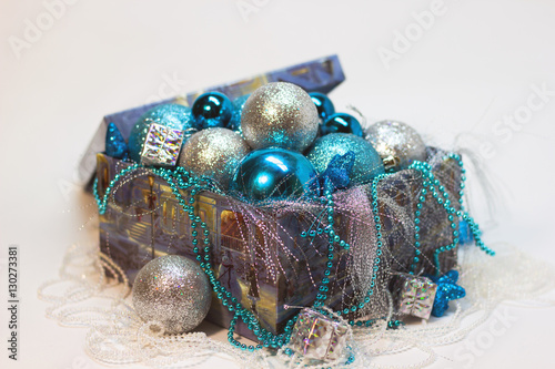 box with Christmas decorations white and blue © Irina