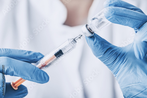 Doctor with injection vaccine vaccination medicine photo