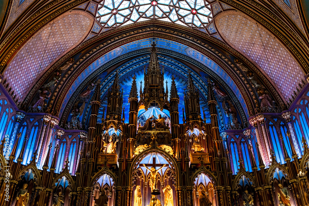 Illuminated altar and ceiling in enormous basilica