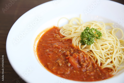 spaghetti bolognese in wood background