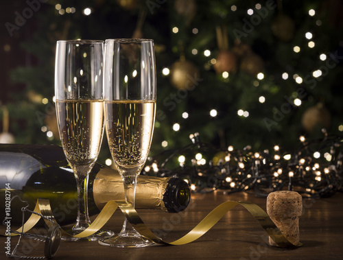 New Year Toast champagne , Christmas tree background