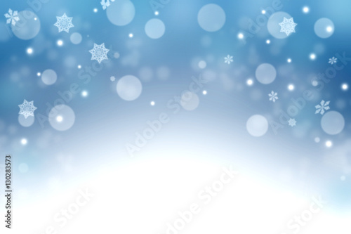Blue winter background with snowflakes and bokeh. Christmas nigh