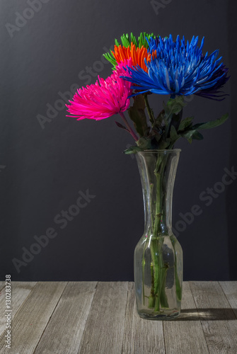 Vibrant mums on a table photo