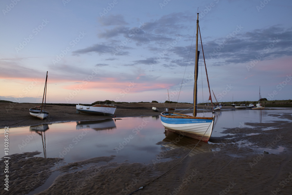 Sunset at low tide at Burnham Overy Staithe, Norfolk Sunset at low tide at Burnham Overy Staithe, Norfolk