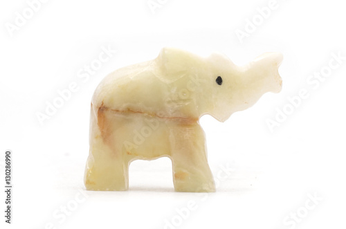 elephant figurine made of natural stone isolated on white © vitaly tiagunov