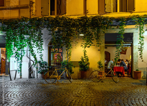 Fototapeta Naklejka Na Ścianę i Meble -  Night view of old cozy street in Trastevere in Rome, Italy