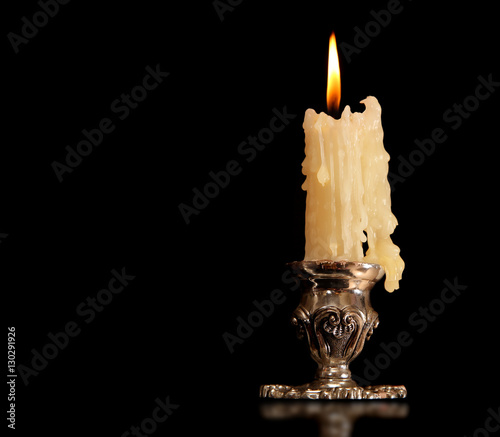 Fotografie, Obraz burning old candle vintage Silver bronze candlestick