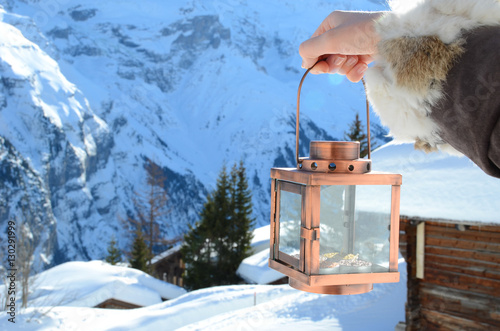 Lantern in the hand. Murren, Switzerland photo