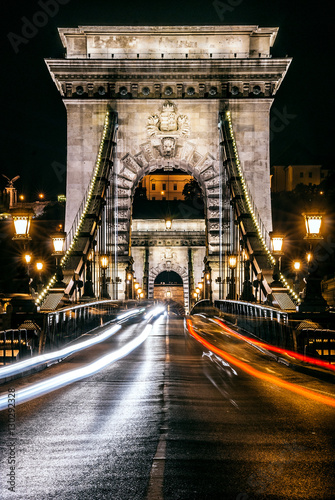 Highway and arc architecture of the Chain Bridge at night in Budapest, capital of Hungary