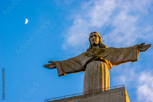 Sunset at Christ the King monument placed in the city of Almada, district of Lisbon, the capital of Portugal