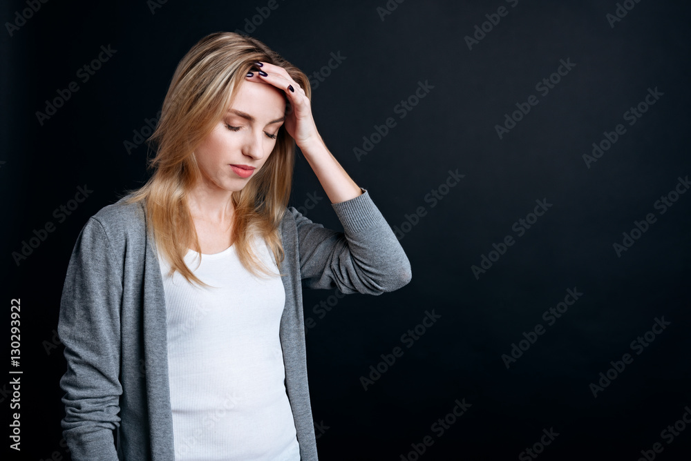 Tired woman having a terribleheadache Tired woman having a terribleheadache