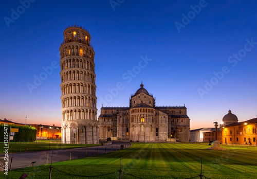 Night view of Pisa Cathedral (Duomo di Pisa) with the Leaning Tower of Pisa (Torre di Pisa) on Piazza dei Miracoli in Pisa, Tuscany, Italy photo