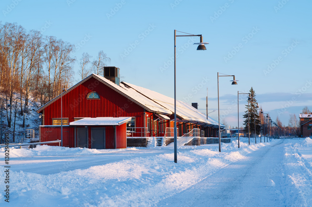 View of small swedish european town Soderhamn, winter seasonal background with red wooden building