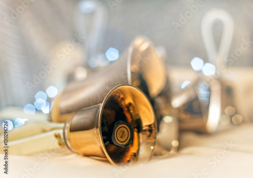 Close-up of girl holding metal bell in hand