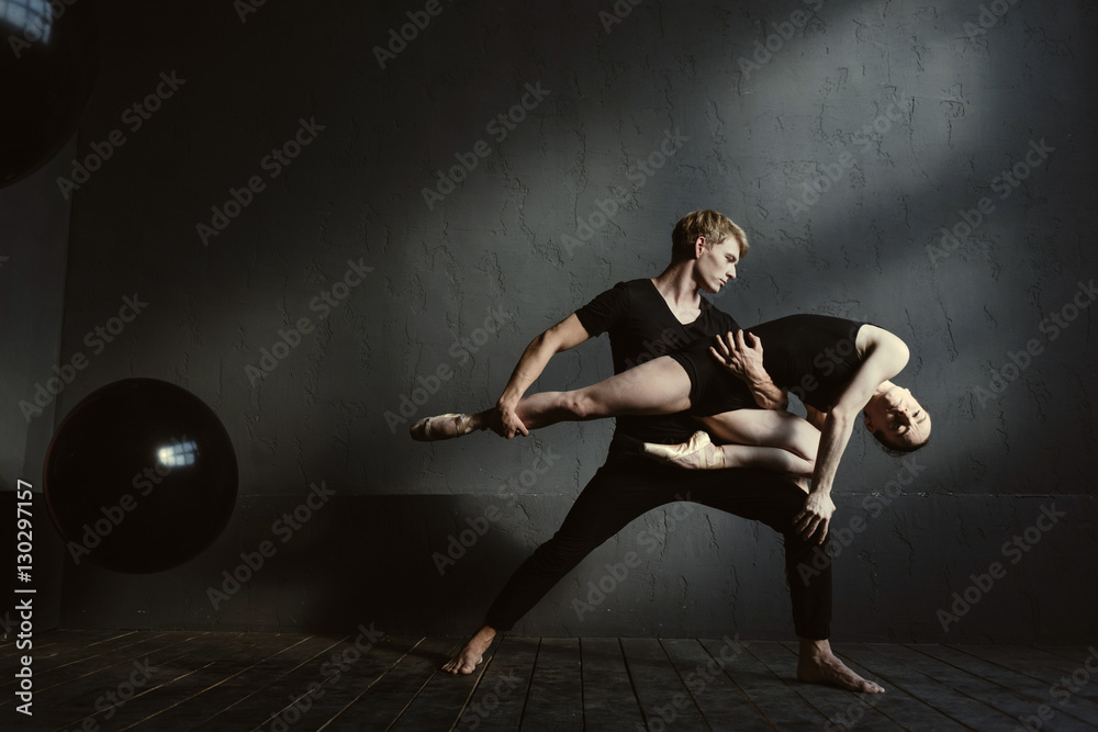 Slender gymnasts dancing in interaction with each other Slender gymnasts dancing in interaction with each other