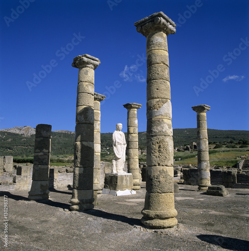 Roman ruins with statue of Emperor Trajan, Baelo Claudia, near Tarifa, Andalucia, Spain photo