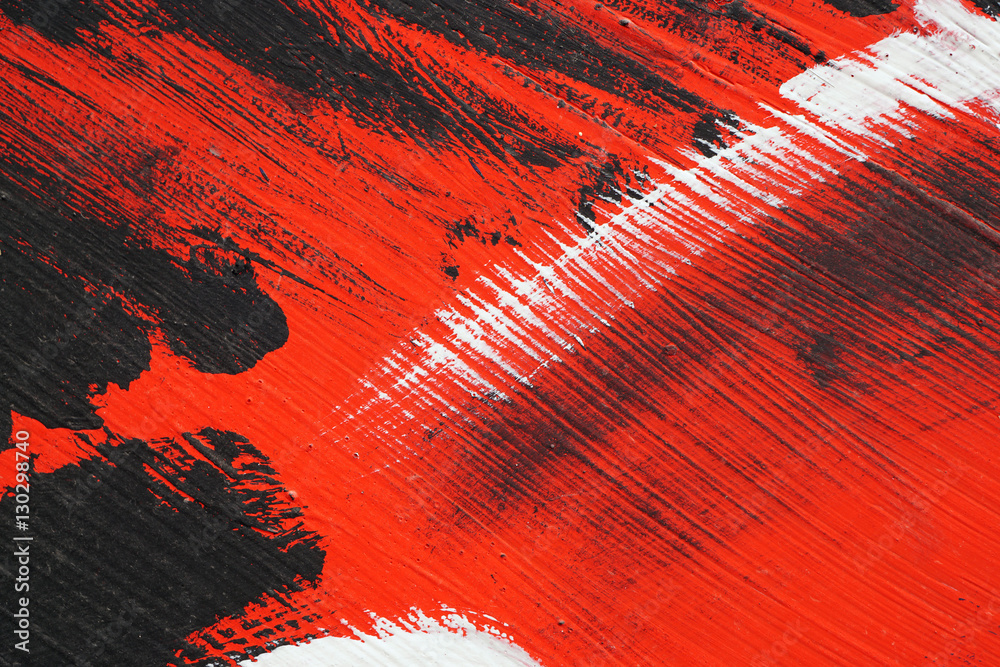 Naklejka premium Black, white, red acrylic paint on metal surface. Brushstroke