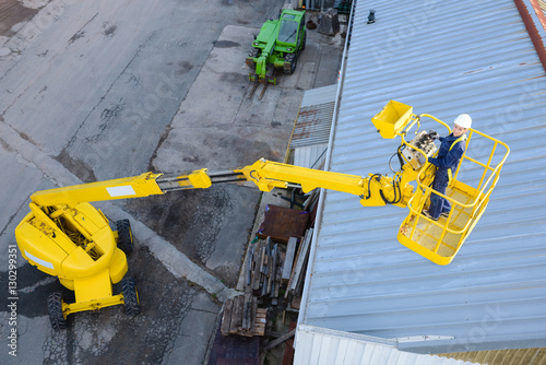 Looking down on woman in cherry picker photo