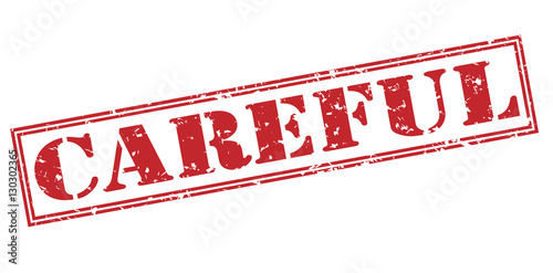 Foto careful red stamp on white background