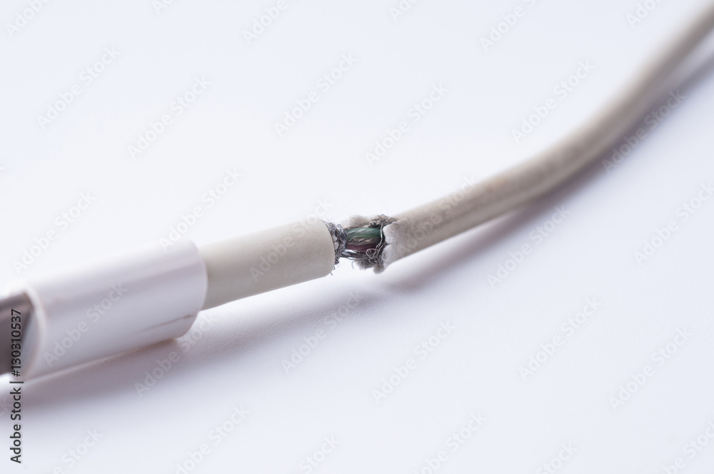 Fototapeta premium Closeup the Broken Smart Phone Charger Cable on white Background