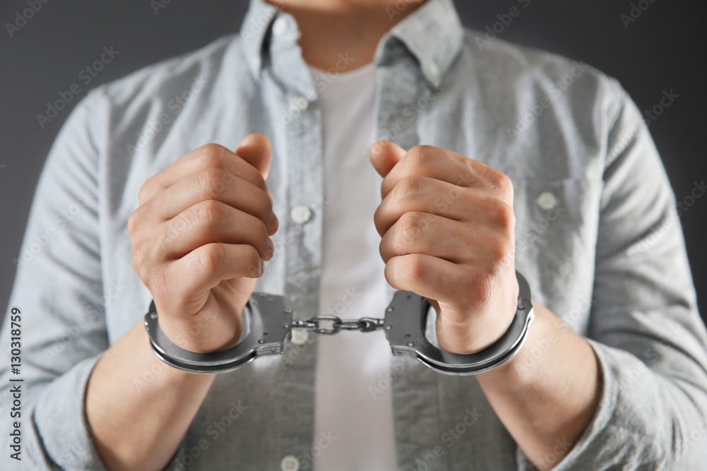 Man in handcuffs, closeup