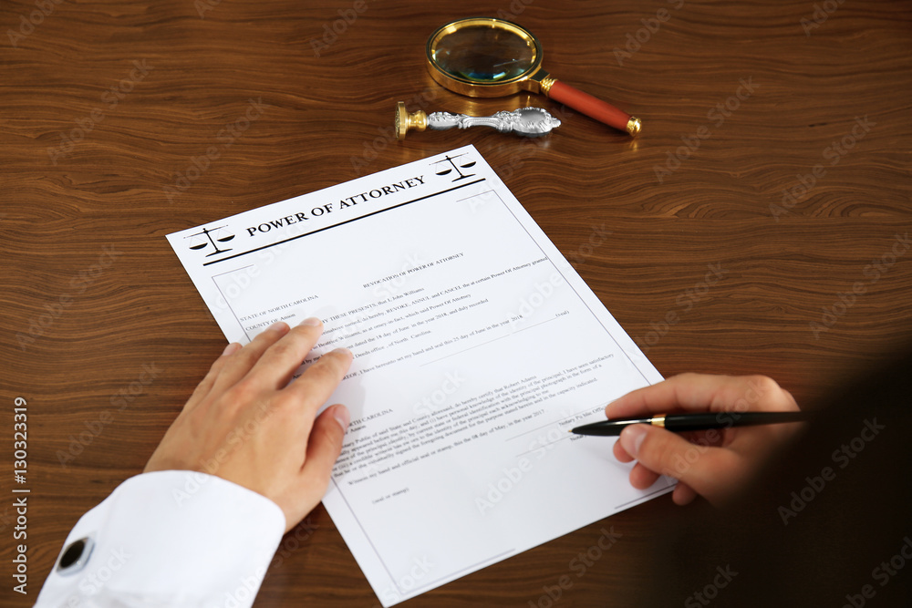 Obraz premium Notary public signing power of attorney in office