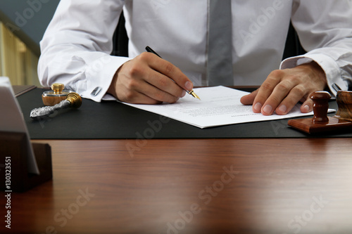 Notary public signing docum...