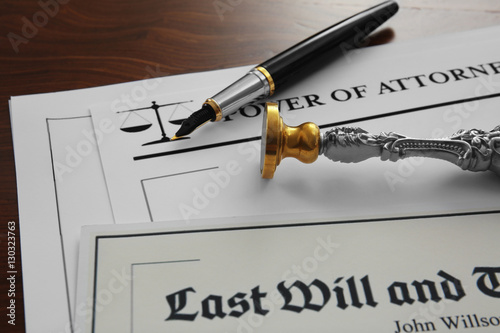 Pen, stamp and documents on...