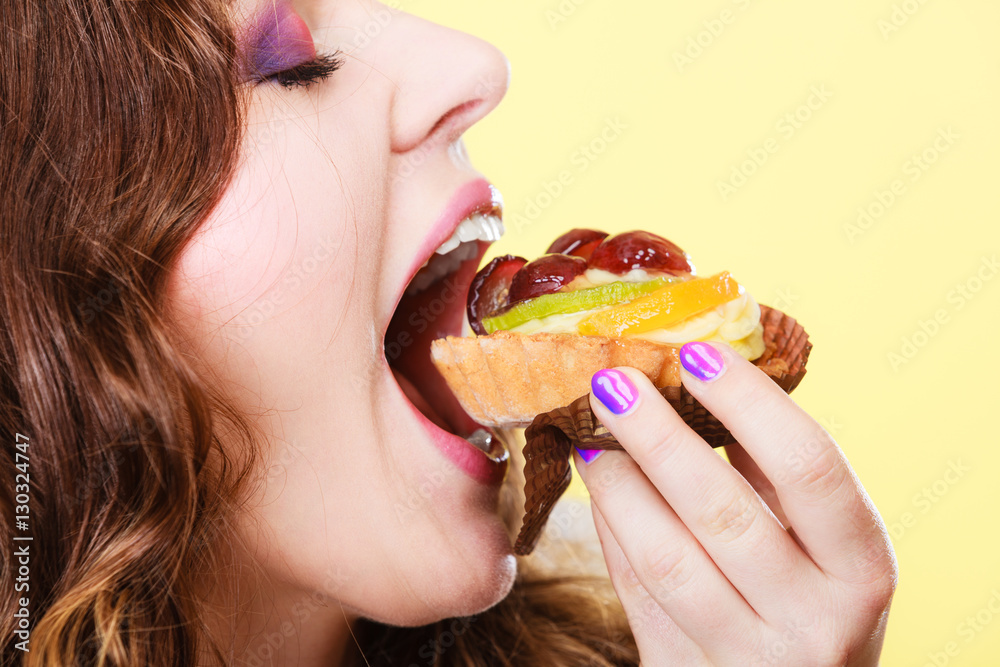 Closeup woman eating fruit cake sweet food Closeup woman eating fruit cake sweet food