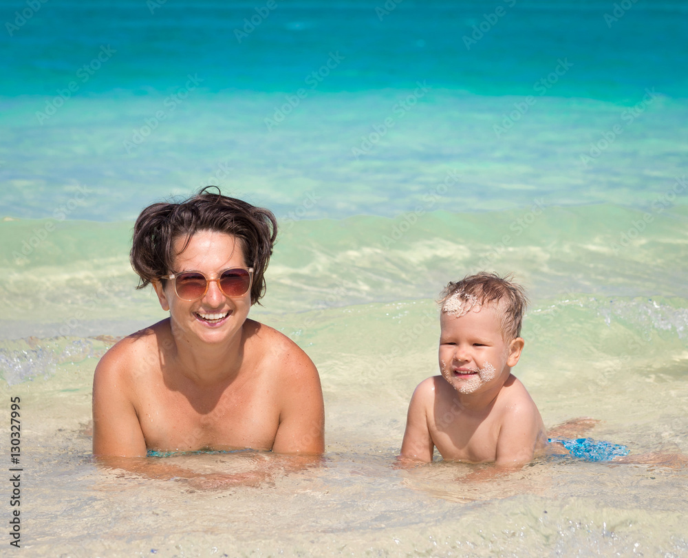 Mother and son relaxing in the sea Mother and son relaxing in the sea