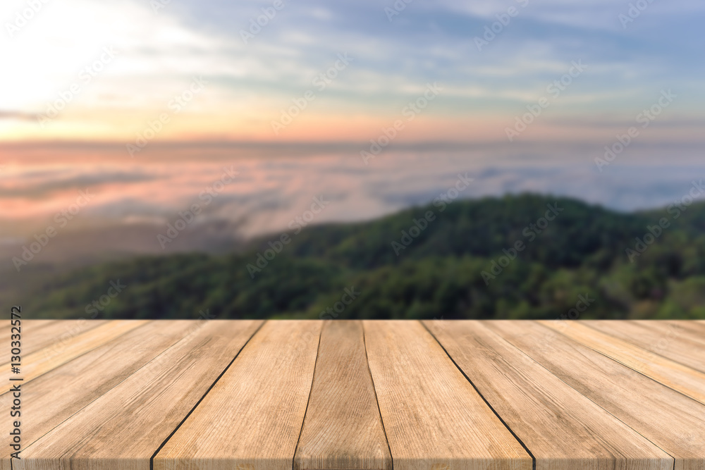 Empty wooden table space platform and blurred Sky mountains sunsets Fog background for product display montage Empty wooden table space platform and blurred Sky mountains sunsets Fog background for product display montage