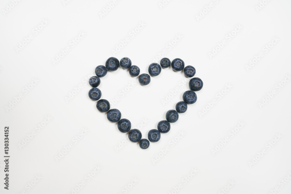 Blueberries in heart shape with white background Blueberries in heart shape with white background