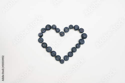 Blueberries in heart shape with white background