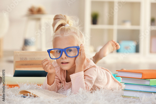 Small girl in glasses with ...