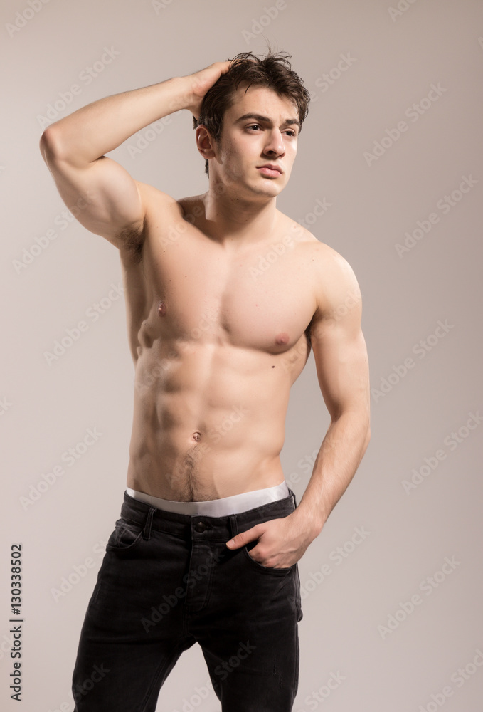 Young sexy muscular man posing