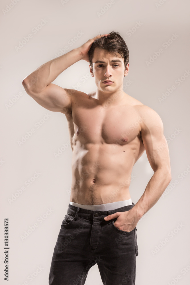 Young sexy muscular man posing