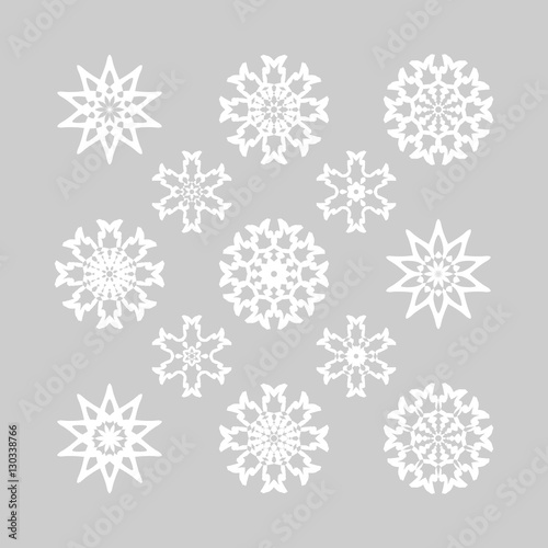 Snowflake set. Collection of different white snowflakes on grey background. Snowflakes for Christmas design. Hipster Style Design for Labels, Badges and Icons.