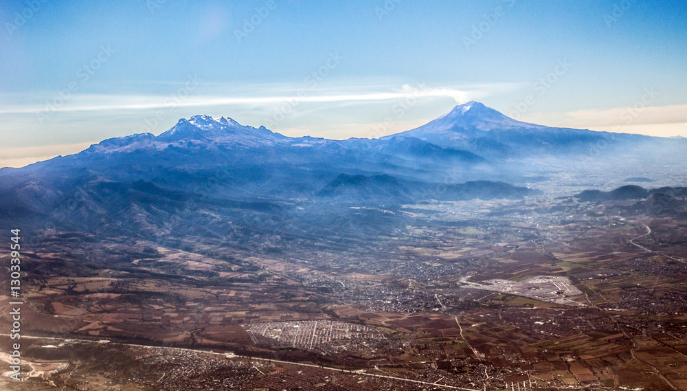 Mexico's "Smoking Mountain" Popocatépetl literlly smoking, next to its  sibling Iztaccihuatl (left) Stock-Foto | Adobe Stock
