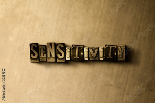 SENSITIVITY - close-up of grungy vintage typeset word on metal backdrop. Royalty free stock illustration.  Can be used for online banner ads and direct mail.