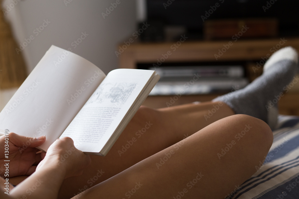 Crop of female reading book