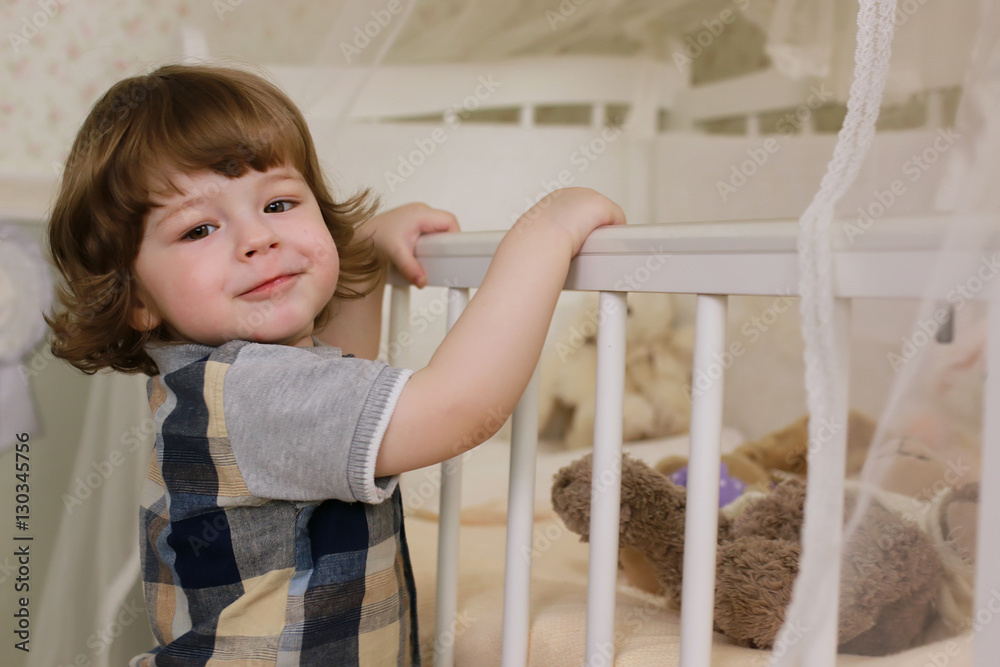 litle kid stand at bedroom