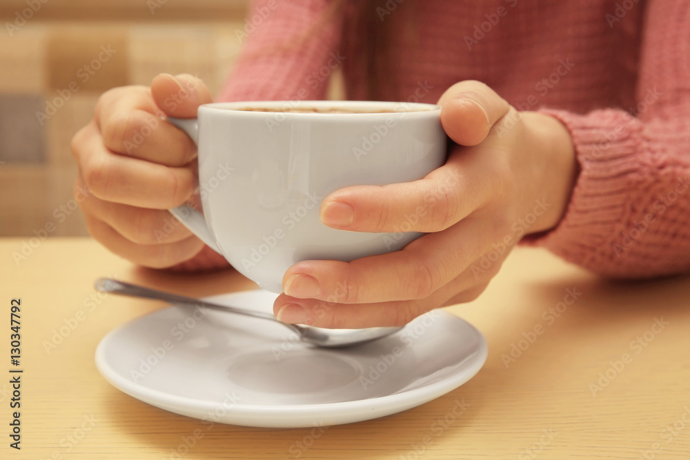 Woman holding cup of coffee, closeup Woman holding cup of coffee, closeup