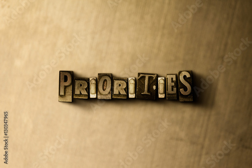 PRIORITIES - close-up of grungy vintage typeset word on metal backdrop. Royalty free stock illustration. Can be used for online banner ads and direct mail.