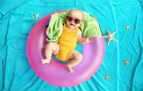 Cute baby with swimming rin...
