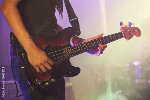 Bass guitar player, close-up photo