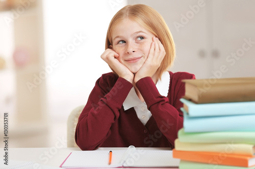 Schoolgirl doing lessons at...
