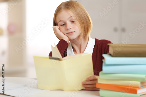 Schoolgirl doing lessons at...