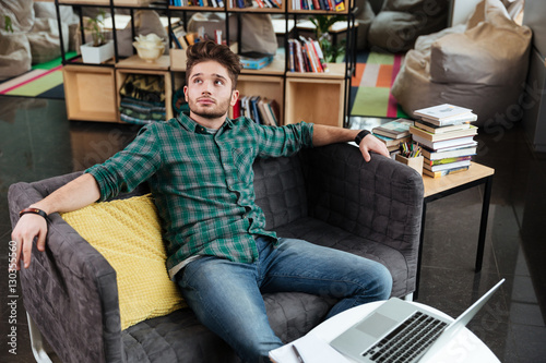 Man resting on sofa