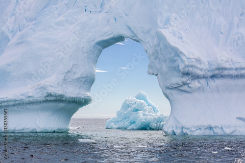 Tableau sur toile Huge arched iceberg near Petermann Island, western side of the Antarctic Peninsu