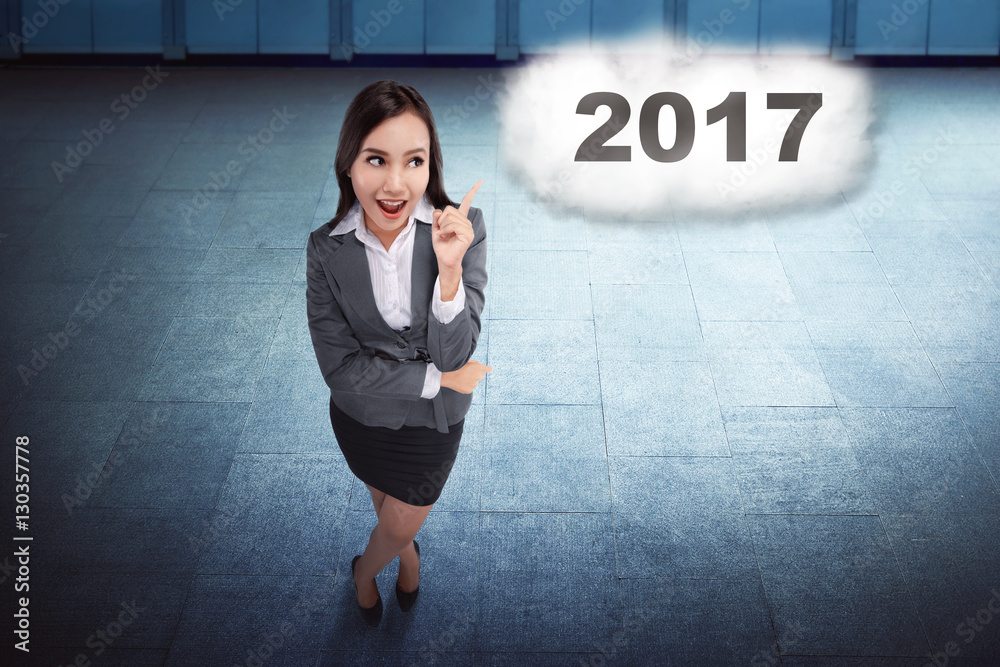 Asian business woman thinking about target on the 2017 Asian business woman thinking about target on the 2017